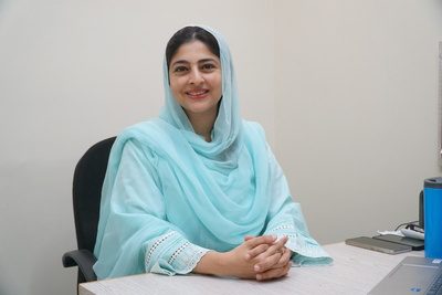 A SINA family physician at her clinic desk